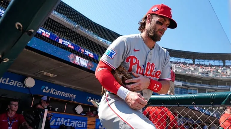 Philadelphia Phillies first baseman Bryce Harper heads to the field...