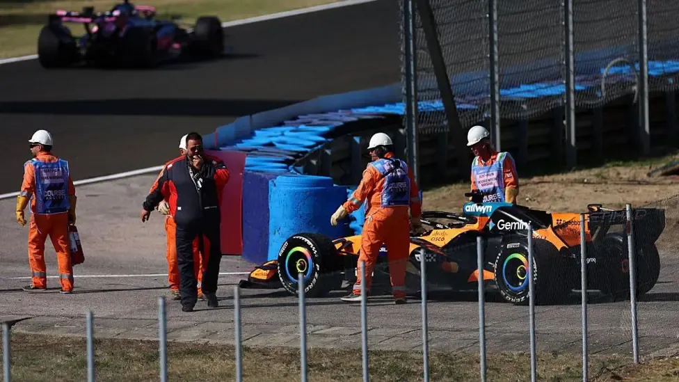 Oscar Piastri's car stopped at the side of the track