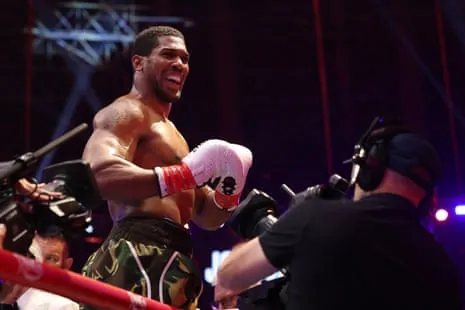 Anthony Joshua celebrates following his second-round knockout of Kristian Prenga.