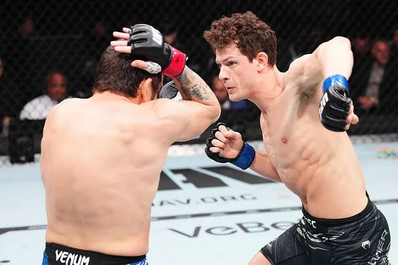 Chase Hooper punches Jim Miller in a lightweight bout during the UFC 314 event at Kaseya Center on April 12, 2025 in Miami, Florida. (Photo by Jeff Bottari/Zuffa LLC)