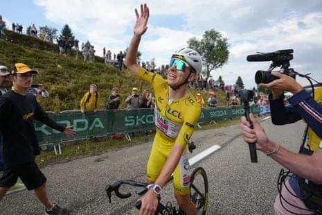 Tadej Pogacar celebrates after winning the 14th stage of the Tour de France