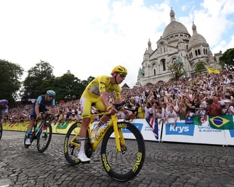 Tadej Pogacar passes Sacré-Coeur as the Tour de France rode through Paris's Montmartre district