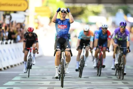 Jasper Philipsen crosses the line